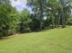 A peaceful view of the community lake, perfect for a relaxing stroll or picnic at 112 Briarfield Dr, Apex, NC 27502