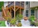 Back patio area with steps to the deck above, offering a multi-level outdoor living space at 112 Briarfield Dr, Apex, NC 27502