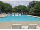 A pristine community pool with lounge chairs perfect for relaxing in the sun at 112 Briarfield Dr, Apex, NC 27502