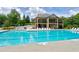 Large community swimming pool with clear blue water and plenty of seating at 112 Briarfield Dr, Apex, NC 27502