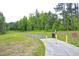 Scenic walking path bordered by lush greenery, ideal for recreation at 112 Briarfield Dr, Apex, NC 27502