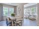 Inviting dining room featuring contemporary decor and large windows with natural light at 1124 Sun Springs Rd, Wake Forest, NC 27587