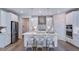 Bright kitchen with stainless steel appliances, island with seating, and sleek cabinetry at 1124 Sun Springs Rd, Wake Forest, NC 27587
