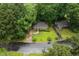 Aerial view of property with mature trees and surrounding neighborhood at 1219 Lakeland St, Durham, NC 27701