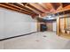 Unfinished basement space featuring exposed wood ceiling beams and potential for customization at 1219 Lakeland St, Durham, NC 27701