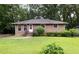 Charming brick home featuring a well-maintained lawn and inviting front entrance at 1219 Lakeland St, Durham, NC 27701