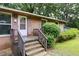 Up close shot of a brick home highlighting the charming front entrance at 1219 Lakeland St, Durham, NC 27701