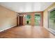 Cozy living area with hardwood floors and natural light streaming through the windows at 1219 Lakeland St, Durham, NC 27701