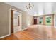 The expansive living room showcases hardwood flooring, natural light, and easy access to the kitchen and front door at 1219 Lakeland St, Durham, NC 27701