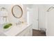 Bathroom featuring a modern vanity with a decorative round mirror at 1246 Nc-27, Benson, NC 27504