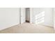 Bright bedroom featuring carpet, ample light, and neutral paint at 1246 Nc-27, Benson, NC 27504