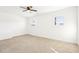 Bright bedroom with neutral carpet and two sunny windows at 1246 Nc-27, Benson, NC 27504