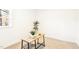 Bright bedroom showcasing a small desk, complemented by a plant and natural light from a window at 1246 Nc-27, Benson, NC 27504