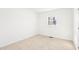 Bedroom featuring neutral carpet, a window, and a door at 1246 Nc-27, Benson, NC 27504
