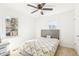 Bedroom featuring carpet, a ceiling fan, and two windows for ample natural light at 1246 Nc-27, Benson, NC 27504