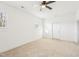 Spacious bedroom featuring two windows for ample natural light and a white door at 1246 Nc-27, Benson, NC 27504