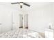 Bright bedroom featuring carpet, a ceiling fan, and a geometric patterned bed cover at 1246 Nc-27, Benson, NC 27504