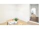 Bright bedroom featuring a minimalist desk with a plant, and a doorway to another room at 1246 Nc-27, Benson, NC 27504