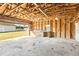 Spacious garage with wood-beam construction and open door provides ample workspace and storage at 1246 Nc-27, Benson, NC 27504