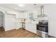 Well-lit kitchen showcasing white cabinets, stainless steel appliances, and modern backsplash at 1246 Nc-27, Benson, NC 27504