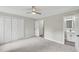 Neutral bedroom featuring carpet, a ceiling fan, and closet at 132 Edgewood Dr, Louisburg, NC 27549