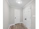 Hallway featuring wood flooring and closet space at 132 Edgewood Dr, Louisburg, NC 27549