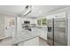 Modern kitchen showcasing stainless steel appliances, a center island, and ample cabinet space at 132 Edgewood Dr, Louisburg, NC 27549