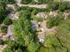 Expansive aerial shot of homes with mature landscaping and a quiet street at 1600 Budwood Dr, Raleigh, NC 27609