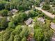 An aerial view showcases a neighborhood with lush greenery and well-maintained homes at 1600 Budwood Dr, Raleigh, NC 27609