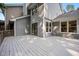Gray home with sliding glass doors leading to backyard deck at 1600 Budwood Dr, Raleigh, NC 27609