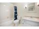 Well-lit bathroom features a shower/tub and vanity with storage at 1600 Budwood Dr, Raleigh, NC 27609