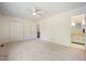 Bedroom with neutral carpet, fan and bathroom attached at 1600 Budwood Dr, Raleigh, NC 27609