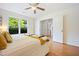 Bedroom with an open doorway, large window, and light-colored walls, creating a bright and airy space at 1600 Budwood Dr, Raleigh, NC 27609
