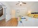 Bedroom featuring neutral decor, closet, large window, and doorway, offering a versatile space at 1600 Budwood Dr, Raleigh, NC 27609