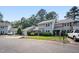 Inviting townhome with a charming facade, featuring an attached garage and a well-kept lawn at 1600 Budwood Dr, Raleigh, NC 27609
