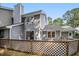 Exterior view of gray home with wooden lattice at 1600 Budwood Dr, Raleigh, NC 27609