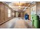 Spacious garage with concrete flooring, paneled walls and good lighting at 1600 Budwood Dr, Raleigh, NC 27609