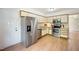 Bright kitchen featuring stainless steel appliances, ample cabinet space, and a door leading to outdoor space at 1600 Budwood Dr, Raleigh, NC 27609