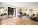 Spacious living room with hardwood floors, a sliding glass door to the deck, and neutral wall paint at 1600 Budwood Dr, Raleigh, NC 27609