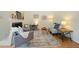 Cozy living room with fireplace, stylish rug, comfortable seating, and ample natural light at 1600 Budwood Dr, Raleigh, NC 27609