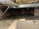 View of a crawl space showing support structures and utilities at 1609 Cypress Dr, Henderson, NC 27536