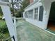 Side porch featuring a white picket railing and steps leading up to the home at 1609 Cypress Dr, Henderson, NC 27536
