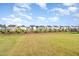 Expansive backyard with lush green grass and well-maintained landscaping at 1725 Winter Jasmine Ln, Wake Forest, NC 27587