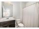 Bathroom with a dark vanity, white countertop and a shower with curtain at 1725 Winter Jasmine Ln, Wake Forest, NC 27587