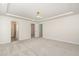 A spacious bedroom features neutral carpet and walls, and an adjoining bathroom and walk-in closet at 1725 Winter Jasmine Ln, Wake Forest, NC 27587