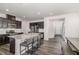 Well-designed kitchen featuring granite countertops, stainless steel appliances and bar stool seating at 1725 Winter Jasmine Ln, Wake Forest, NC 27587