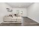 Relaxing living room with neutral decor, wood floors, and lots of natural light at 1725 Winter Jasmine Ln, Wake Forest, NC 27587
