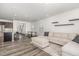 Spacious living room with neutral walls, wood floors, and comfortable seating arrangement at 1725 Winter Jasmine Ln, Wake Forest, NC 27587