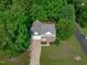 Charming home featuring a welcoming front porch, surrounded by lush trees and a well-manicured lawn at 188 Worthington Ct, Clayton, NC 27527