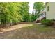 Green backyard view of the screened porch and privacy fence at 188 Worthington Ct, Clayton, NC 27527